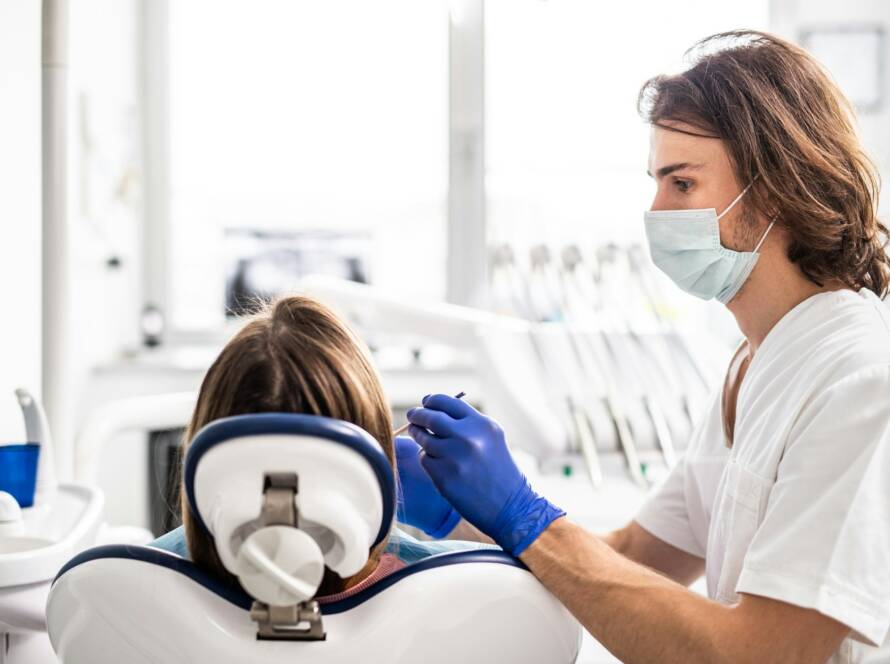 A dental check-up of patient in dentist surgery