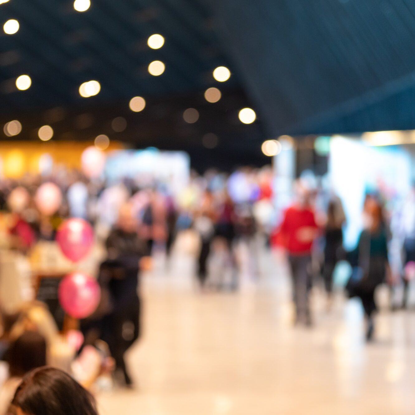 Blurred crowd of people in modern interior during event
